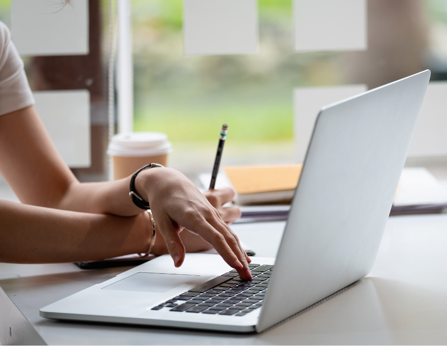 Person typing on a laptop